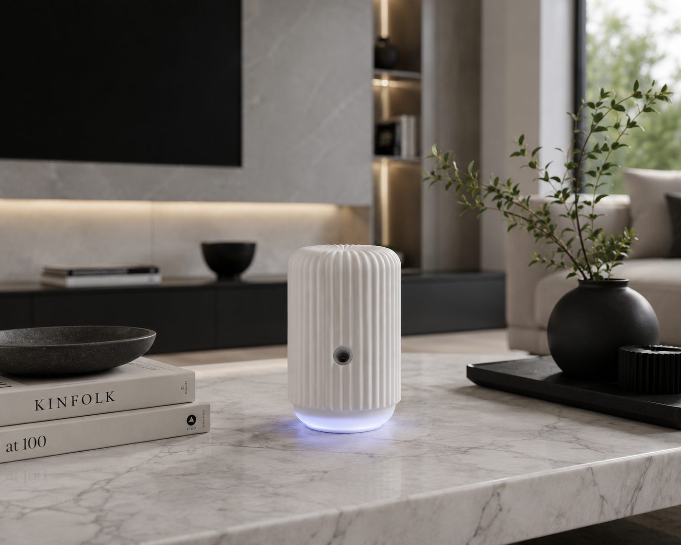 A warm, dimly-lit luxury living room with the Scentsy Solo on a marble side table